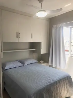 Uma cama ou camas num quarto em Apartamento Duplex em Itapema a 250 metros do mar