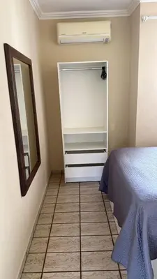Uma cama ou camas num quarto em Cobertura Frente Mar