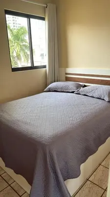 Uma cama ou camas num quarto em Cobertura Frente Mar