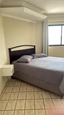 Uma cama ou camas num quarto em Cobertura Frente Mar