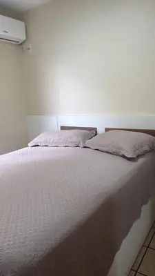 Uma cama ou camas num quarto em Apto Frente Mar