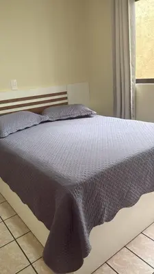 Uma cama ou camas num quarto em Apto Frente Mar