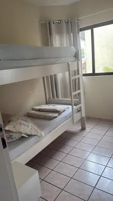 Uma cama ou camas num quarto em Apto Frente Mar