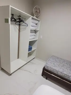 Uma cama ou camas num quarto em Novo Lar Itapema-2