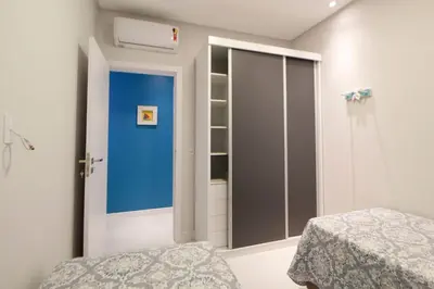 Uma cama ou camas num quarto em 1087 Apto na praia de Bombinhas