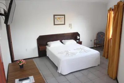 Uma cama ou camas num quarto em Hotel Bela Onda