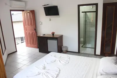 Uma cama ou camas num quarto em Hotel Bela Onda