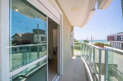 Uma varanda ou terraço em Apartamento vista para o mar com 02 dormitórios