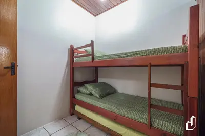 Uma cama ou camas num quarto em Casa de praia simplesmente encantadora