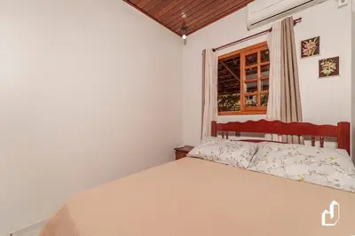 Uma cama ou camas num quarto em Casa de praia simplesmente encantadora