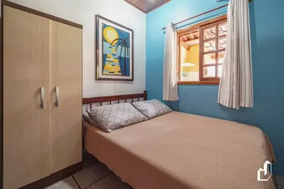 Uma cama ou camas num quarto em Casa de praia simplesmente encantadora