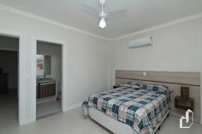 Uma cama ou camas num quarto em Apartamento com 02 dormitórios
