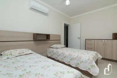 Uma cama ou camas num quarto em Apartamento com 02 dormitórios