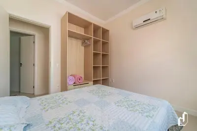 Uma cama ou camas num quarto em Apartamento com 03 dormitórios
