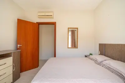 Uma cama ou camas num quarto em Casa com piscina e área de lazer com 08 dormitórios