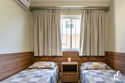 Uma cama ou camas num quarto em Apartamento térreo com 02 dormitórios
