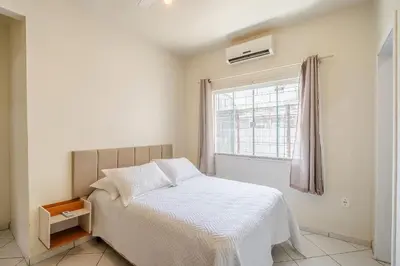 Uma cama ou camas num quarto em Casa com 04 dormitórios