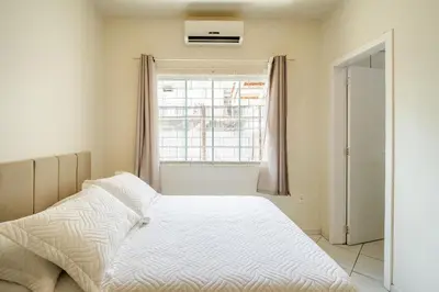 Uma cama ou camas num quarto em Casa com 04 dormitórios