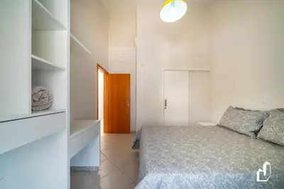 Uma cama ou camas num quarto em Casa com 05 dormitórios ideal as férias na praia