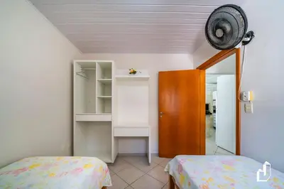 Uma cama ou camas num quarto em Casa com 05 dormitórios ideal as férias na praia
