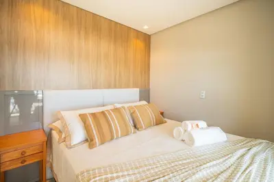 Uma cama ou camas num quarto em Frente ao mar | 2 suítes | Residencial Guilhermina