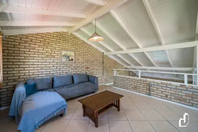 Uma área de estar em Casa de Praia | Para até 08 pessoas