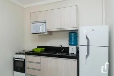 A cozinha ou kitchenette de Próximo ao mar como você e sua família merecem
