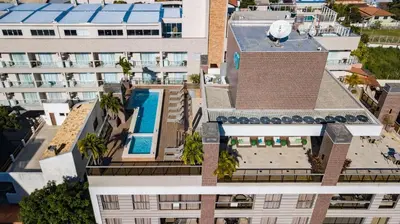 A planta de Porto Madero 202 – Apartamento Moderno em Condomínio com Piscina e Academia no Rooftop no Centro de Bombinhas.