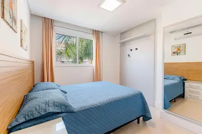 Uma cama ou camas num quarto em Boulevard -Condomínio com Piscina e Jacuzzi