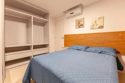 Uma cama ou camas num quarto em Boulevard -Condomínio com Piscina e Jacuzzi