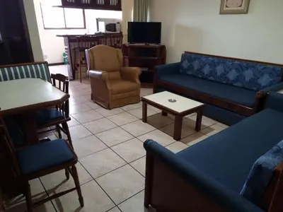 Uma área de estar em Hotel Residencial Itapema