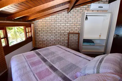 Uma cama ou camas num quarto em BANGALÔ CASA GRANDE - EXCLUSIVIDADE, CONFORTO E PRIVACIDADE.