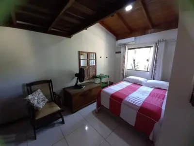 Uma cama ou camas num quarto em Loft praia Porto Belo