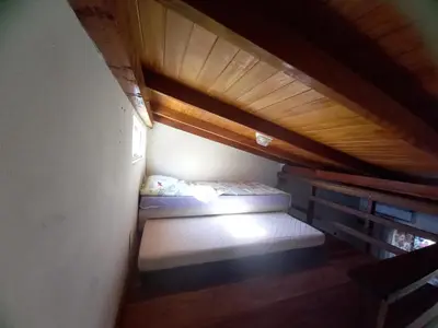 Uma cama ou camas num quarto em Loft praia Porto Belo