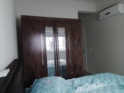 Uma cama ou camas num quarto em Palm Ville paraíso de Palmas com elevador e piscina