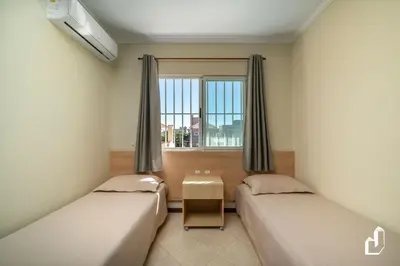 Uma cama ou camas num quarto em Apartamento com 02 dormitórios