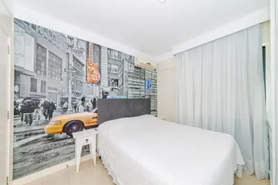 Uma cama ou camas num quarto em 3 Suítes Linda Vista da Orla de BC a 50m da Praia