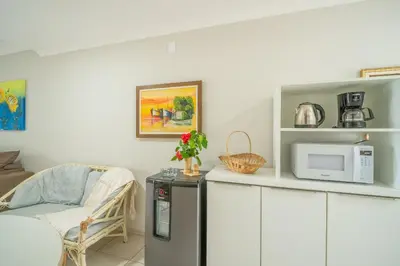 A cozinha ou kitchenette de Frente ao mar - Residencial Guilhermina - Casa 08
