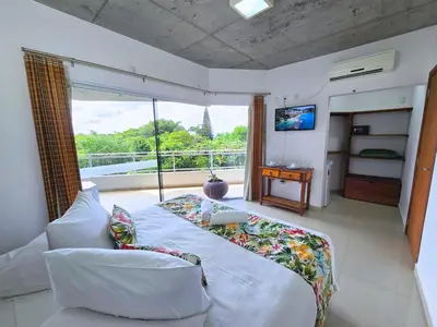 Uma cama ou camas num quarto em Refúgio da Lagoinha - Centro de Bombinhas