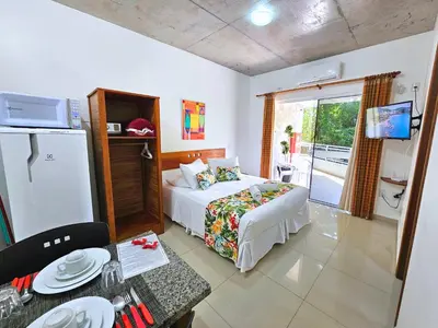 Uma cama ou camas num quarto em Refúgio da Lagoinha - Centro de Bombinhas