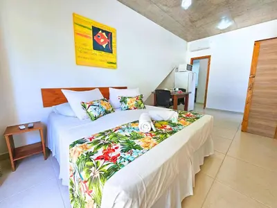Uma cama ou camas num quarto em Refúgio da Lagoinha - Centro de Bombinhas