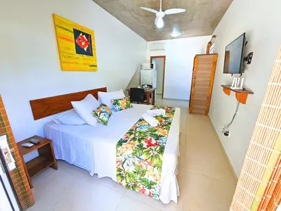 Uma cama ou camas num quarto em Refúgio da Lagoinha - Centro de Bombinhas