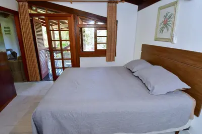 Uma cama ou camas num quarto em BANGALÔ CASA DO MAR - EXCLUSIVIDADE, CONFORTO E PRIVACIDADE.