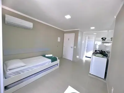 Uma cama ou camas num quarto em Bella Catarina Bombinhas