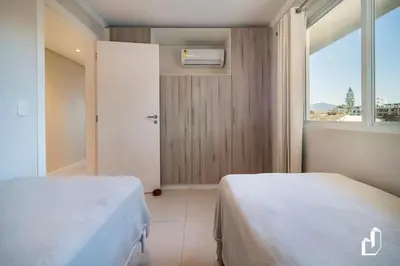 Uma cama ou camas num quarto em Kremer Residence - Apartamento 303