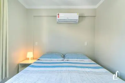 Uma cama ou camas num quarto em Kremer Residence - Apartamento 203