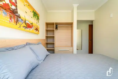 Uma cama ou camas num quarto em Residencial Maresias - Apartamento 101 térreo