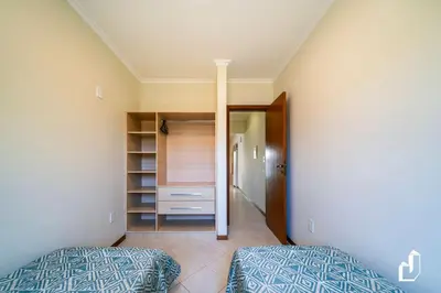 Uma cama ou camas num quarto em Residencial Maresias - Apartamento 101 térreo