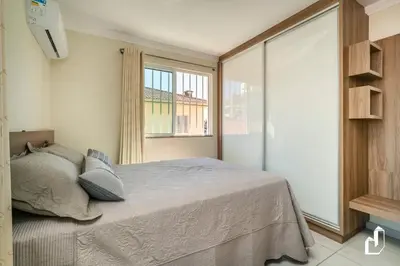 Uma cama ou camas num quarto em Aqui tudo contribui para felicidade e o bem-estar