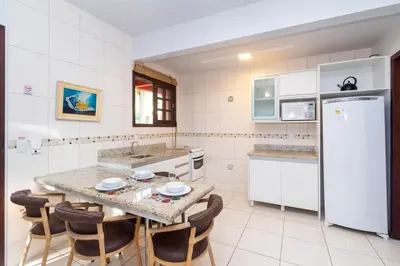 A cozinha ou kitchenette de Dubai Bungalows Bombinhas